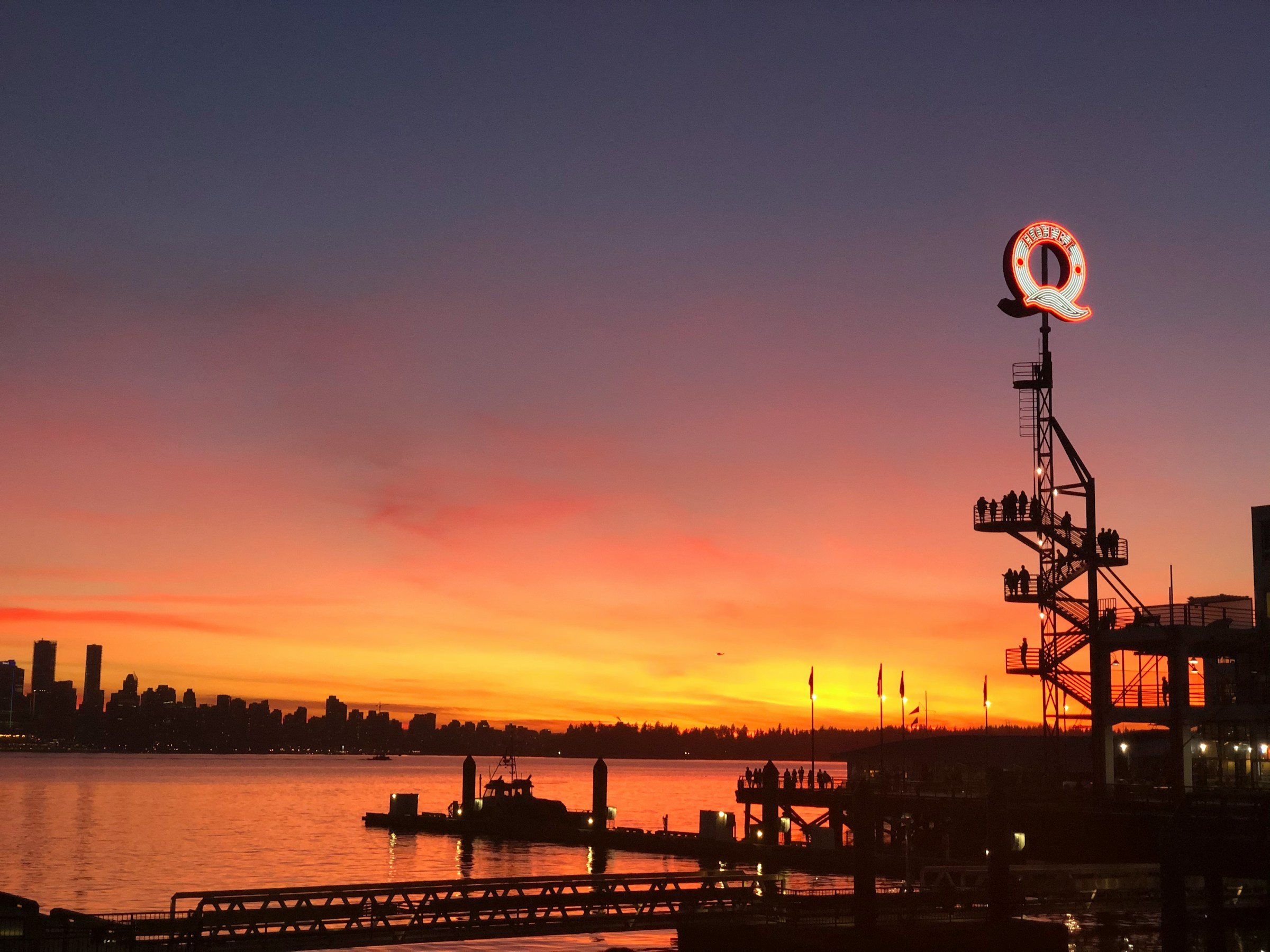 Sunset over Burrard Inlet and the Vancouver skyline from Lonsdale Quay in North Vancouver