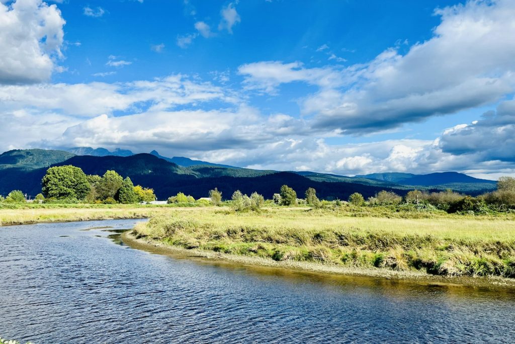 A river winding through farmland in Pitt Meadows