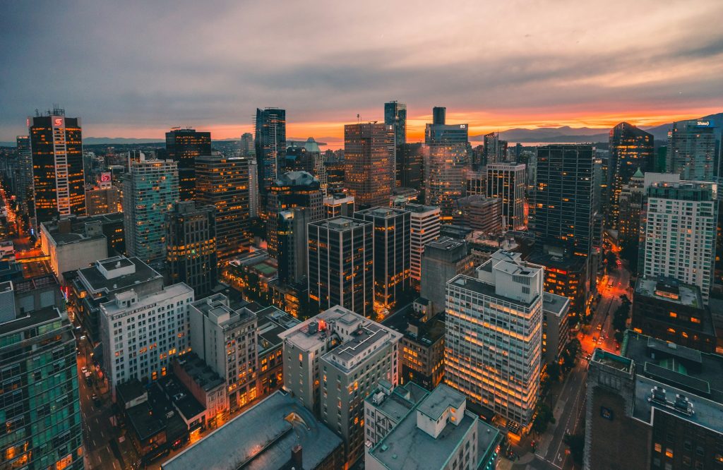 Downtown Vancouver towers lit up at dusk