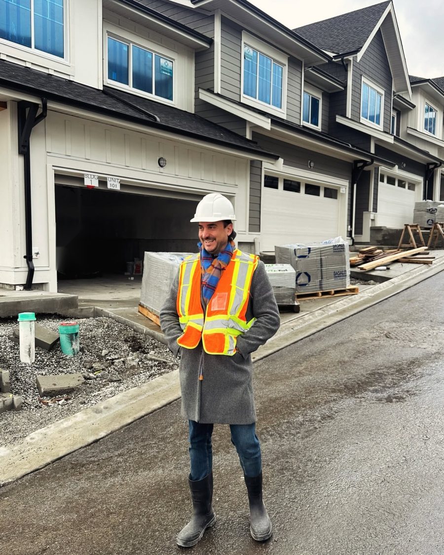Mehrdad Haghjoo in a hard hat at a pre-sale construction site