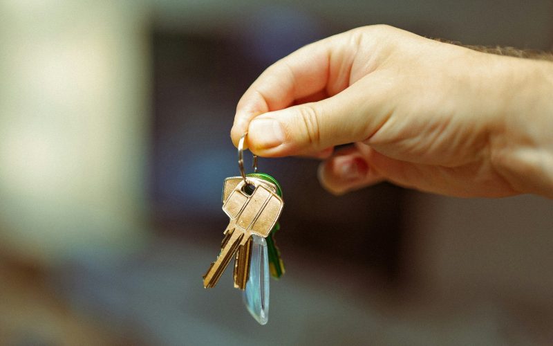 Hand holding a set of house keys