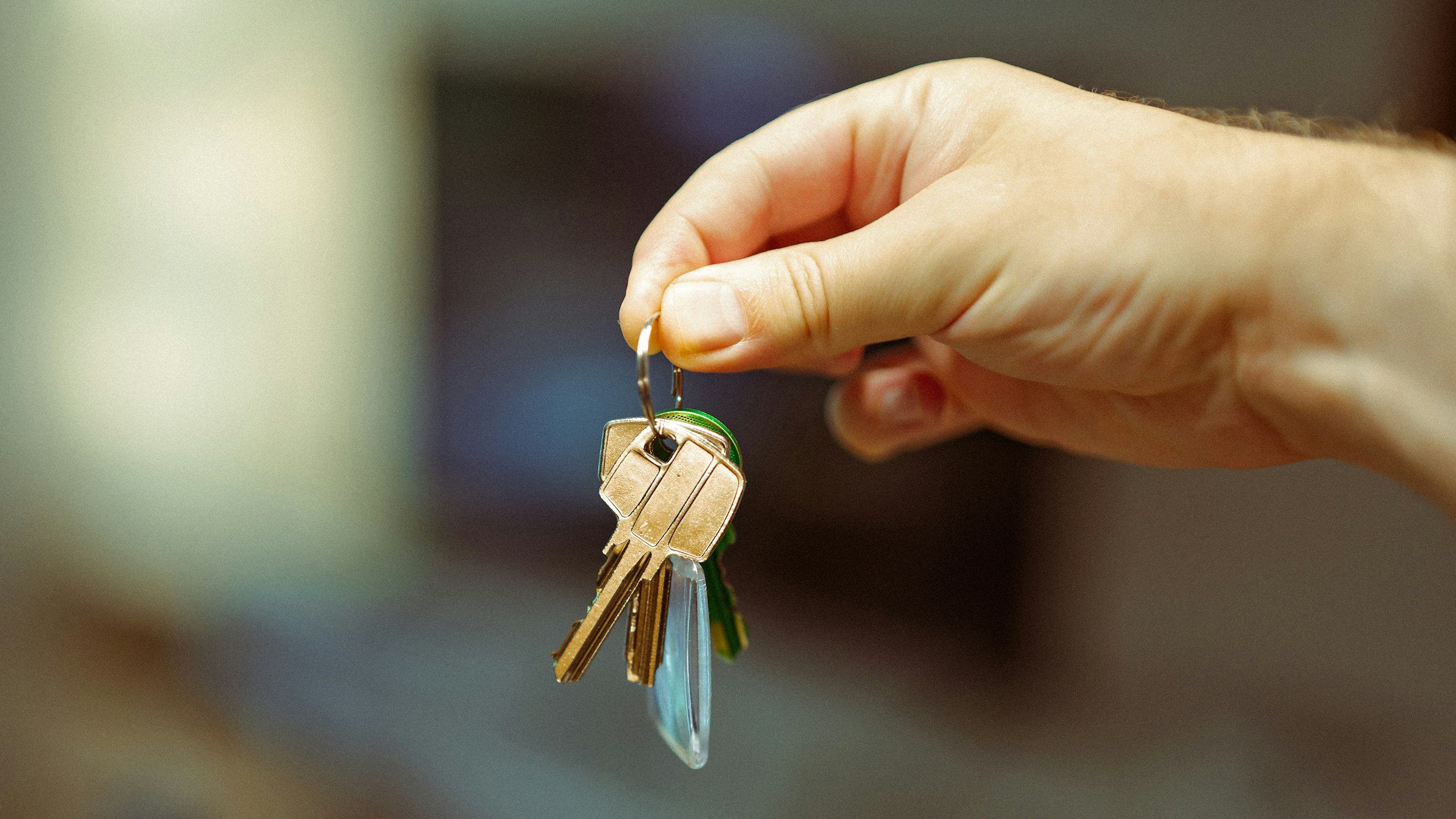 Hand holding a set of house keys